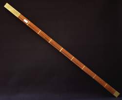 Metre-rule in wood with metal heads Foto &copy; Paolo Bonavoglia